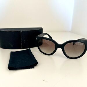 Prada sunglasses. Comes with cloth and case.